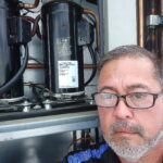 HVAC technician performing system inspection in Ocala Florida