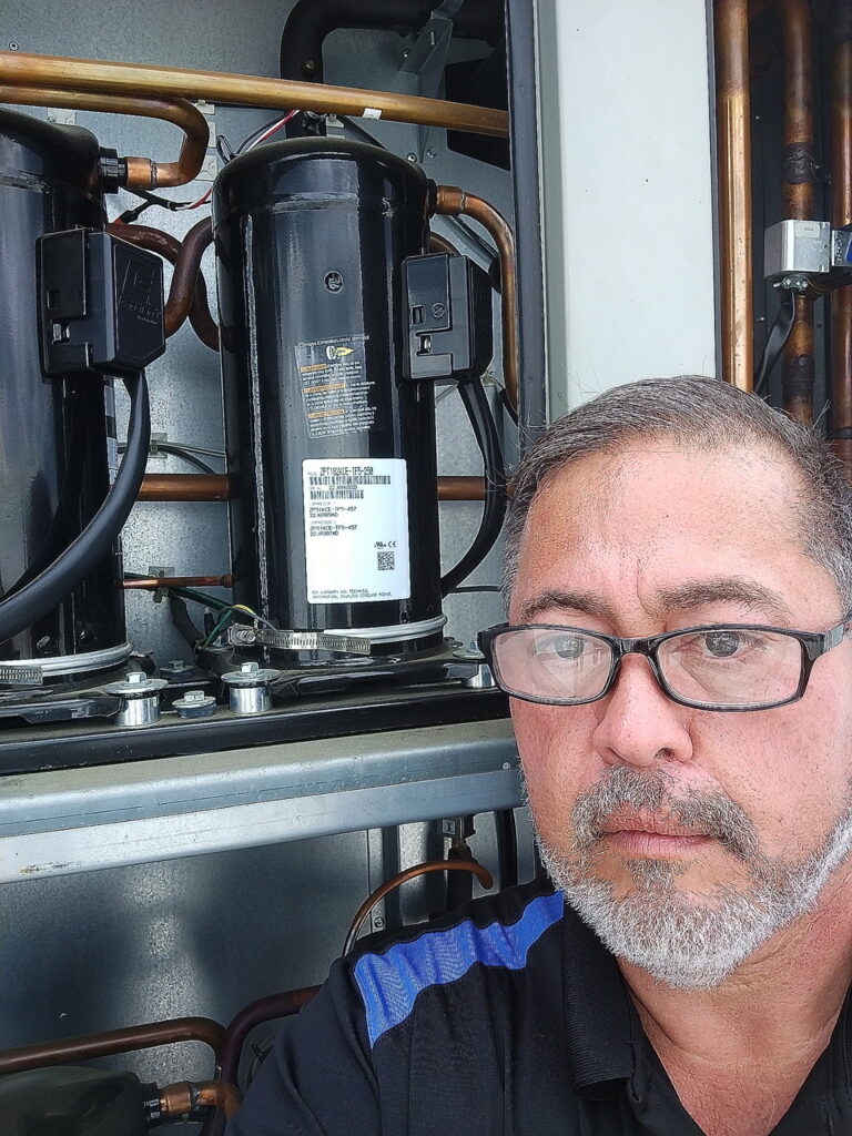 HVAC technician performing system inspection in Ocala Florida